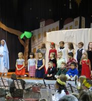 First grade sings “O Bethlehem” with Mary, Caroline M. & Joseph, John C.