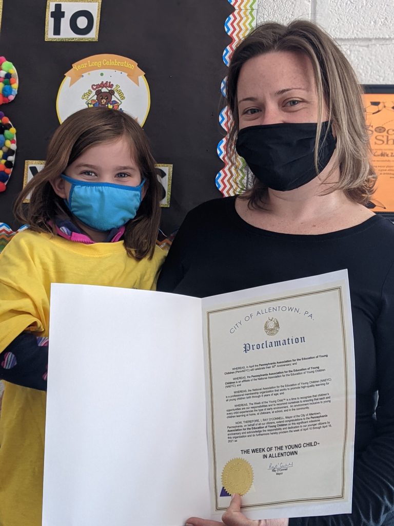 Heather Scherer, Education Director of The Cuddle Zone Learning Center, Allentown, and her daughter Autumn Morris, holding the proclamation from Mayor O'Connell