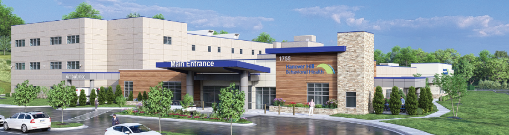 A building with a blue roofDescription automatically generated